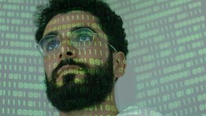 boy with 0 and 1 on his face with glasses and a beard