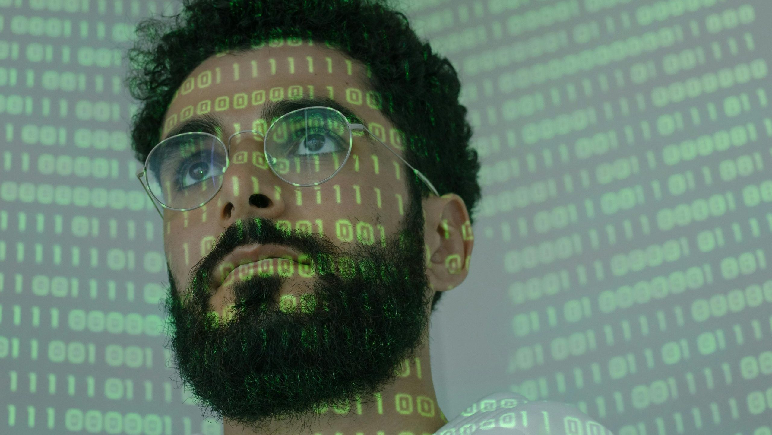 boy with 0 and 1 on his face with glasses and a beard