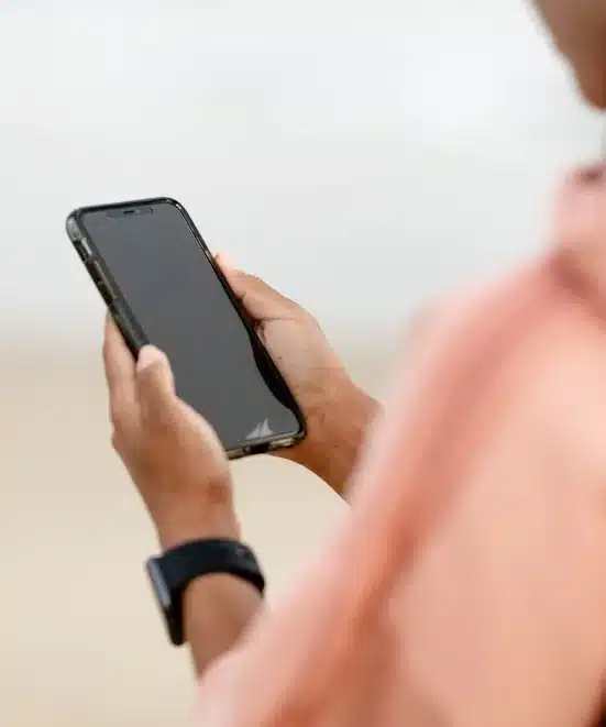 Hand with phone: alert for each fake profile removed