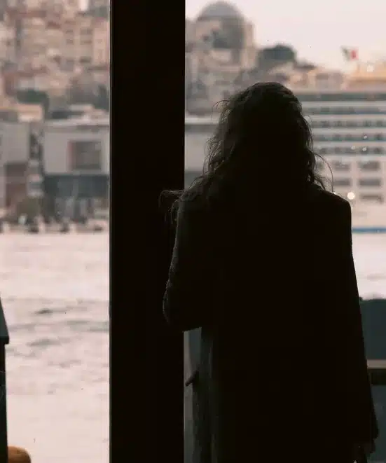 Silhouette by a window: we handle your case with discretion