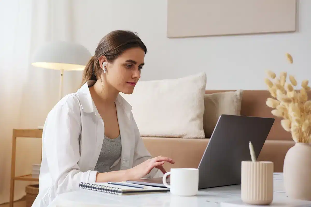 Woman at her laptop gathers the links she wants removed from the internet