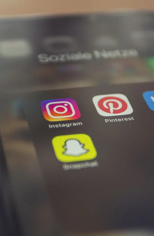 Social media icons on a phone, the route a defamatory post travels