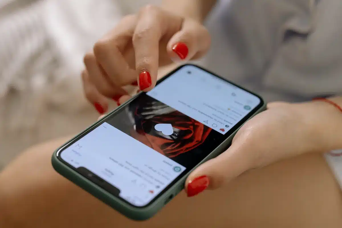 Hands holding a phone open on a profile: the fake profile link to get started