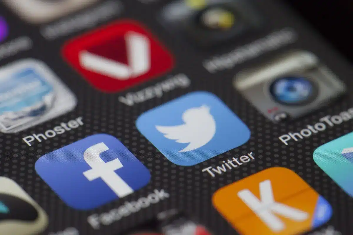 Social network icons on a screen: tracking the copies of the profile