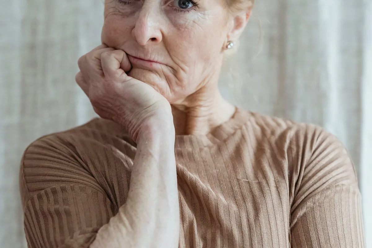 Woman looking at a post that breaches her right to honour